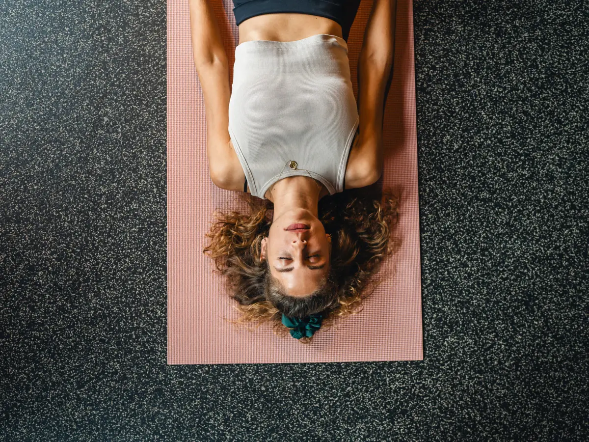 Yoga Urban Nature St. Peter-Ording a woman lying on a yoga mat