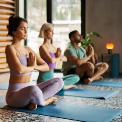 Group of young people during a yoga session in a modern studio