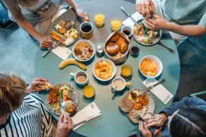 A group of people are eating at a table.