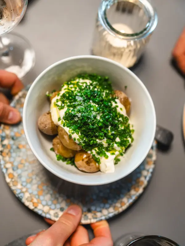 A small bowl of potatoes and quark photographed from above.