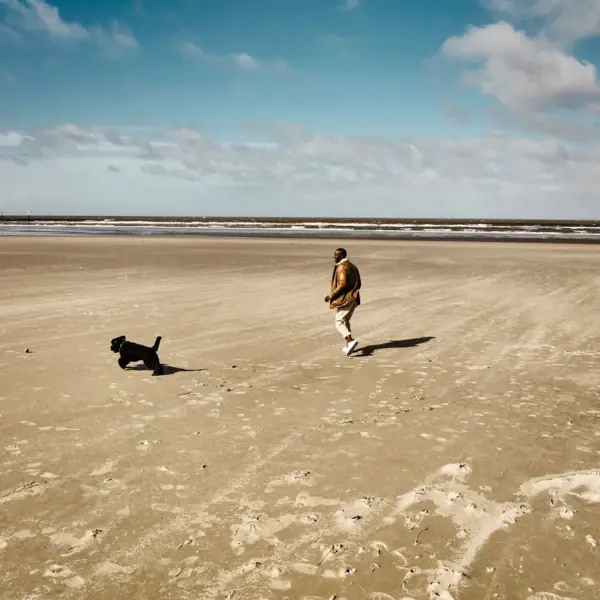 St Peter-Ording Dog Beach A man and a dog on the dog beach in St Peter-Ording.