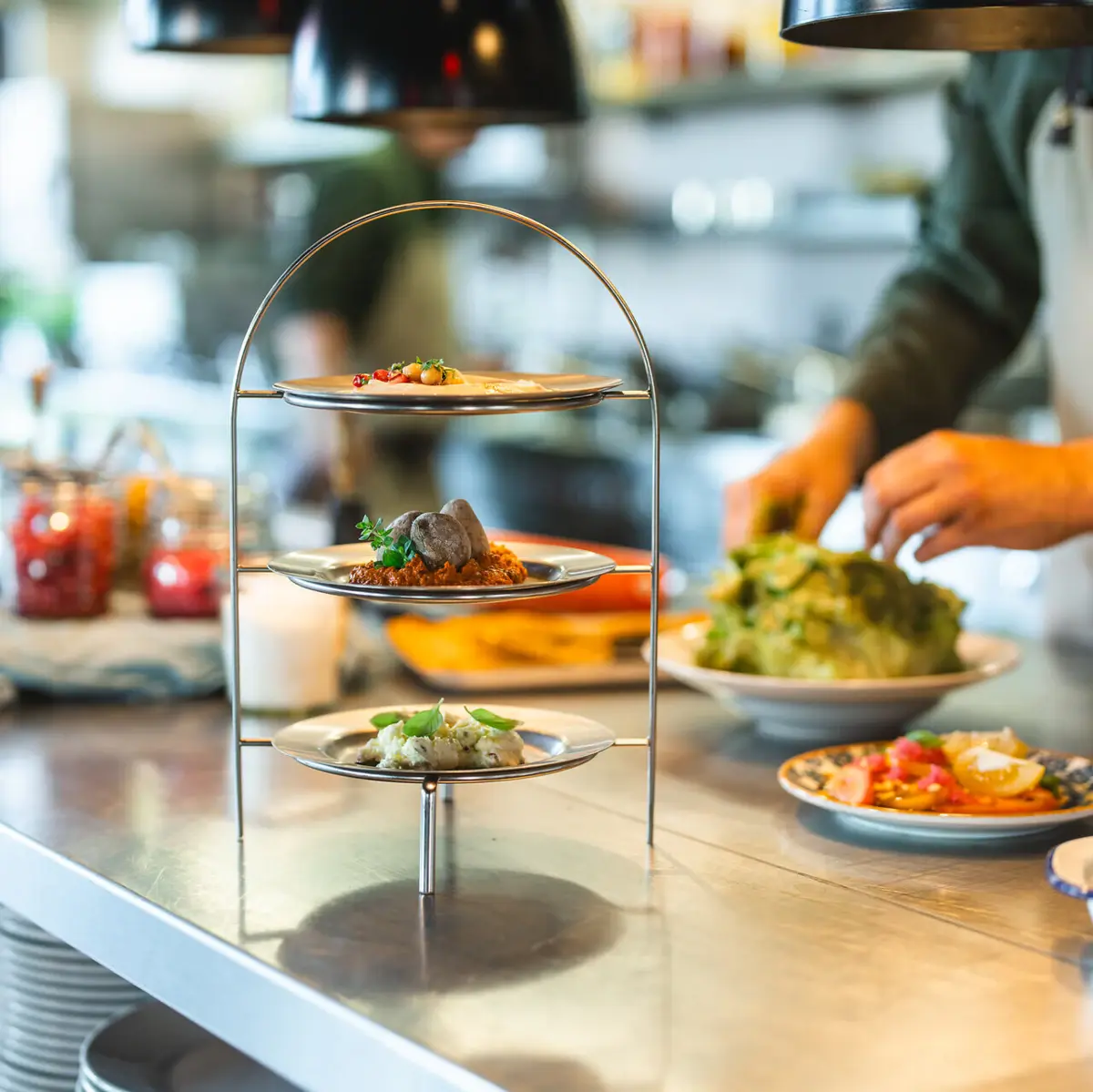 Dip trio on a tiered tray in the open kitchen – where flavour meets craftsmanship at Urban Nature.