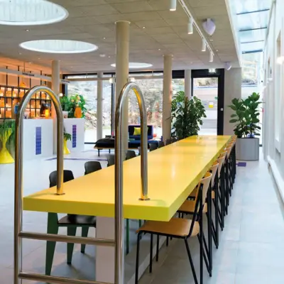 Lobby Bad Gastein A yellow table stands in a lobby.
