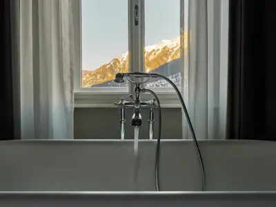 Bathtub Bad Gastein A bathtub stands in front of a window.