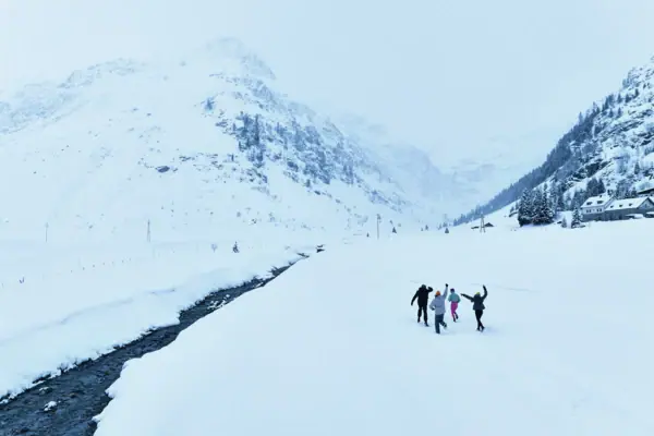 Winter in Bad Gastein A group of people are going for a walk in the snow.