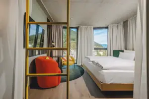 A room with a bed and a television.