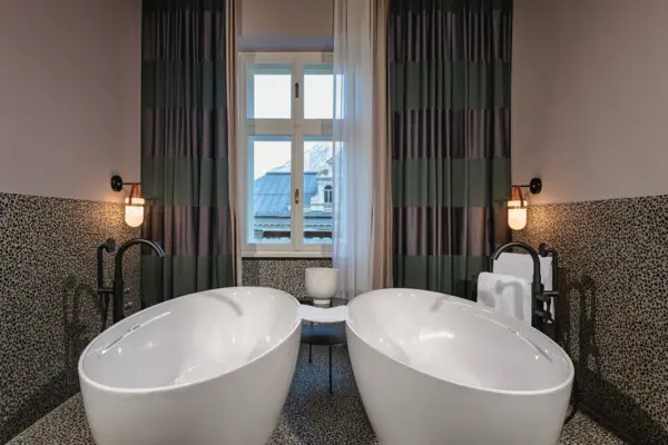Urban Nature Baths, Bad Gastein A bathroom with two white baths.