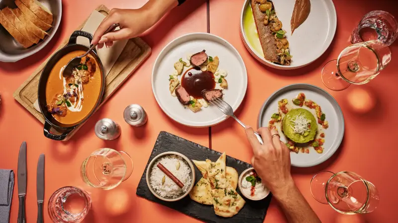 A table photographed from above with many plates and dishes.