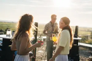 A group of women holding drinks.