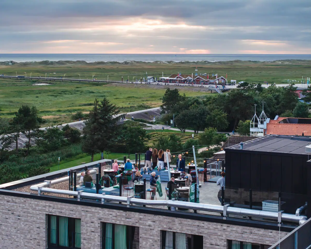 Rooftop Bar A group of people in the rooftop bar at the Urban Nature Hotel in St. Peter-Ording.