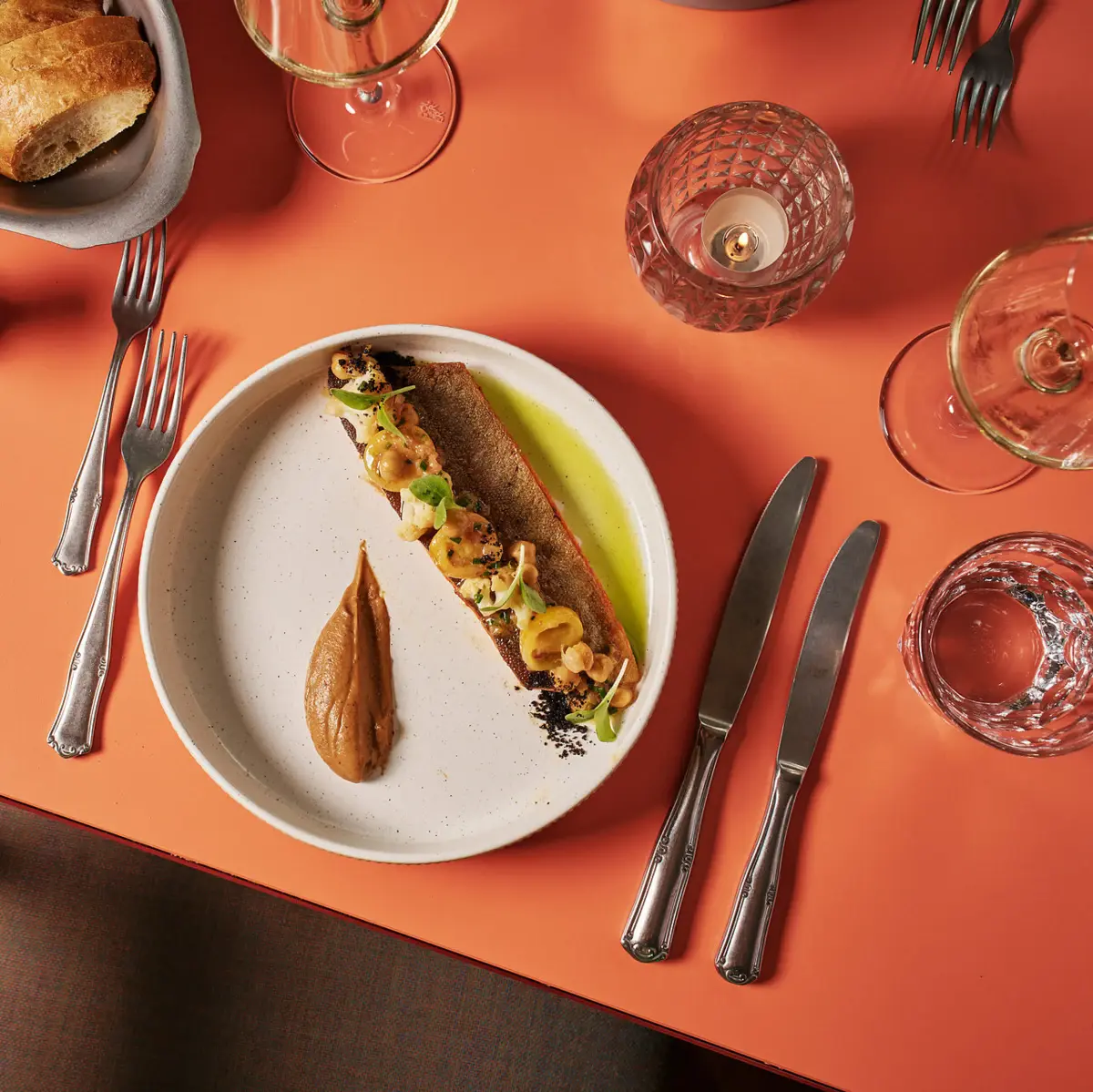 A table with a plate photographed from above.