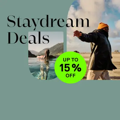 Stay Dream Deals Man and woman in water under a cloudy sky.